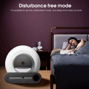 Smart self-cleaning cat litter box next to bed with woman and cat, highlighting disturbance free mode for sleep.